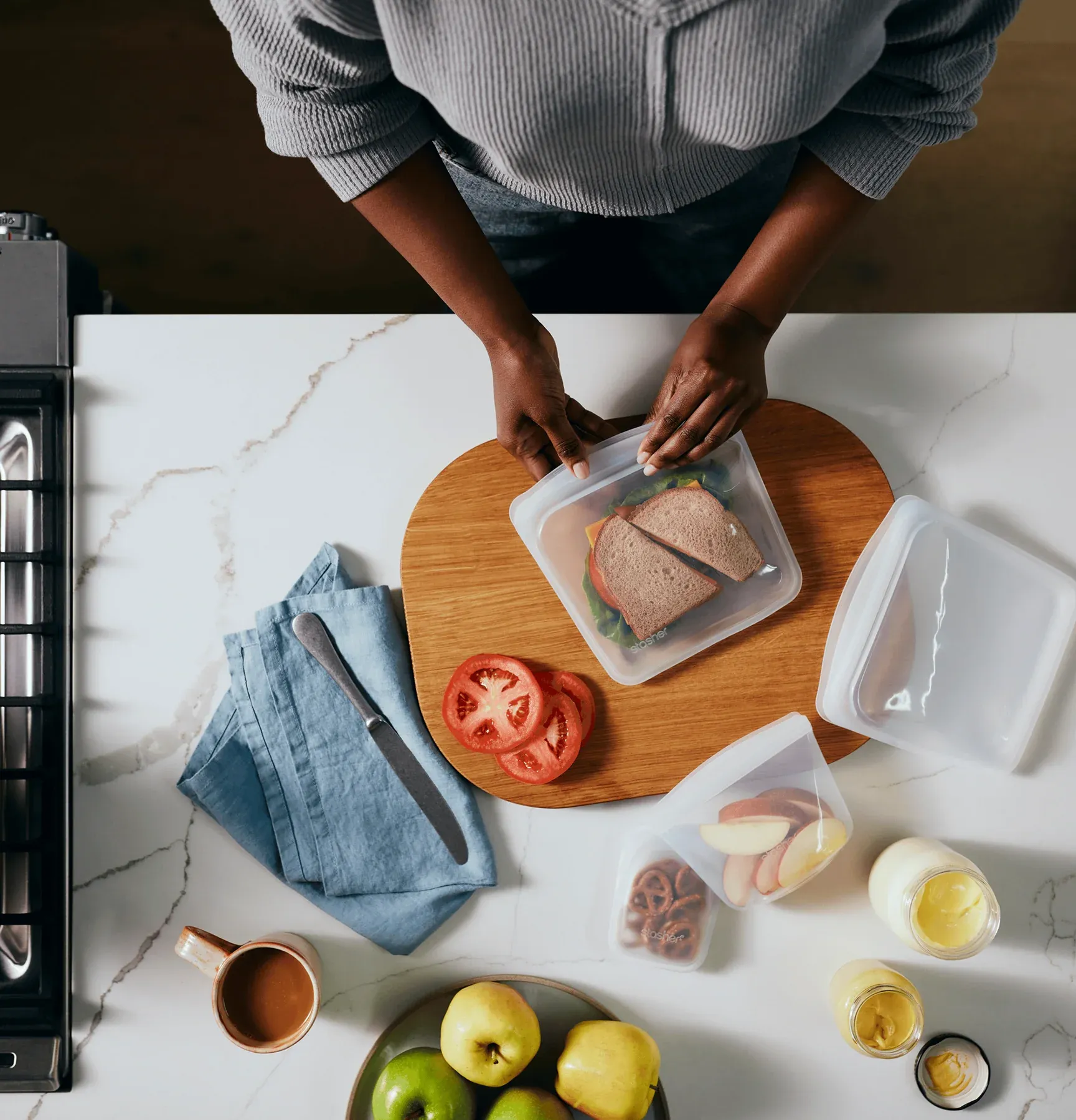 Stasher reusable silicone bags in use on kitchen counter