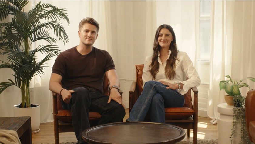 Two people seated in a bright, casual setting