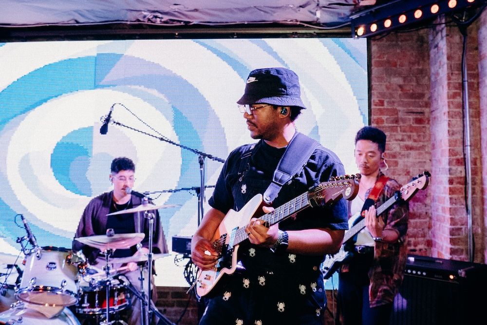 Heavy Bloom play live at Baba Yaga - drummer, guitarist, and bassist shown - photo by Conner Yi